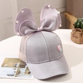 Detail of a purple breathable mesh sun hat with a large bow and pearl lollipop accent - 2-10 Years (48-54cm) / Purple Grey (Lollipop Bow)