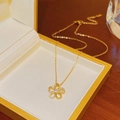 Luxury gold flower pendant necklace with crystals presented in a yellow jewelry box - X104 Five-Petal Flower Zirconia / Gold