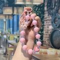 Handmade pink pearlescent beaded phone strap with heart and rabbit charms for bags - Pink Rabbit