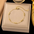 Elegant gold stainless steel infinity symbol bracelet with adjustable chain on jewelry box - Infinity Symbol (E2008) Gold