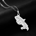 Detailed view of silver Martinique map pendant necklace on a premium black leather texture - Steel Engraving Type A