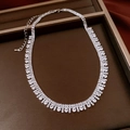 Macro shot of silver multi-layer zircon fringe necklace in a premium jewelry gift box - Silver