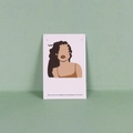 Detail view of black round stud earrings displayed on an illustrated white card - 6x9cm / Profile Illustration (XL-KP120)