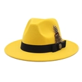 Detail view of yellow wool felt fedora with a black ribbon, spotted feather and gold button - M (56-58cm) / Yellow