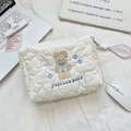 Detail of white quilted cosmetic bag with cute bear embroidery and pink zipper pull - Cloud Animal