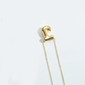 Luxury gold bubble letter C pendant necklace with a minimalist puffy metallic finish - Letter J