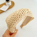 Detail of a wide beige braided headband featuring a twist knot design and natural fiber texture - Beige