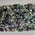 Polished hexagonal fluorite crystal pendants with silver clasps in purple and green hues - Colorful Fluorite