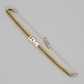 Dettaglio del braccialetto etnico intrecciato con ciondolo LOVE argento e cordino - Geometrico Giallo Verde Marrone-Ciondolo LOVE