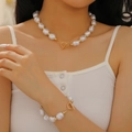 Baroque irregular pearl necklace and bracelet set with golden OT toggle clasp on model - Gold Large Baroque Pearl Necklace Bracelet Set (DZ-075)