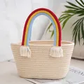 Detail of hand-woven beige tote bag featuring vibrant rainbow handles and tassel accents - Off White