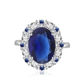 Elegant silver ring featuring oval blue gemstone with halo of white and blue crystals - Adjustable Open / Blue Zirconia