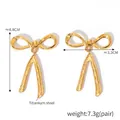 Detailed macro view showing dimensions of 18K gold plated bow ribbon tassel earrings - Gold Linear Bow (F1478)