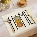 Fall placemat with HOME pumpkin print on light beige linen fabric for table decor - HOME Triple Pumpkins
