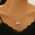 Charmante roze kralenketting met camerapresentatie voorzien van parels en stras - Roze Kralen Camera Halsketting (6608)