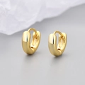 Macro shot of minimalist gold hoop earrings with polished finish and snap closure - Polished Smooth Style / Small / Gold