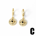 Vergulde evil eye oorringen met zwarte steen en witte zirkonia accenten - Ronde Geometrische Stijl C (C)