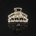 Detail of 5cm golden alloy hair claw with pearls and rhinestones on black background - Half Rhinestone Half Pearl Mini Crescent 5CM Claw Clip