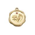 Golden infant palm and footprint charm pendant with red gemstone and sun engraving - Red Zirconia