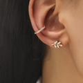 Close-up of gold olive leaf earring and sparkling cubic zirconia ear cuff on ear - Gold (DZ-512)