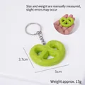 Green pretzel keychain model with metal ring and dimensions 3.7cm x 5cm shown on white - Matcha Green Heart Cookie - Keychain