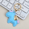 Creative light blue leather horse keychain with a golden money bag charm and pink accents - Mini / Blue