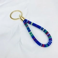 Bohemian woven wrist strap keychain with multi-color fabric cord and golden metal ring - Orange/Blue
