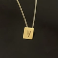 Macro shot of 18K gold-plated stainless steel rectangular pendant with embossed letter V - Pendant Only / Letter V