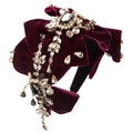 Macro shot of luxury burgundy velvet headband with crystal bows and rhinestones - Burgundy