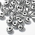 Close-up of zebra pattern acrylic loose beads for DIY jewelry and crafts making - 10mm Zebra Pattern White