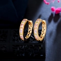 Golden hoop earrings with colorful cubic zirconia stones on professional display stand - Light Multi-color