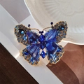 Vintage gold-toned butterfly brooch featuring deep blue crystals and enamel inlay - Vintage Crystal Blue Butterfly