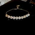 Detail of gold adjustable bracelet with sparkling heart-shaped zircon stones on dark background - 8# Gold Double Layer Heart Zircon Bracelet