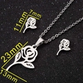 Elegant rose flower jewelry set with polished necklace and earrings on black background - Rose / Steel