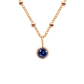 Rose gold necklace featuring a round dark blue gemstone pendant and beaded chain - September Royal Blue - Rose Gold