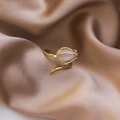 Elegant gold tulip ring featuring a white cat-eye stone inlay and adjustable band - White Cat Eye Ring / Gold