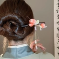 Wooden hair pin with pink and green flowers and pearl tassels on a hair bun - Hairpin #159 - Pink