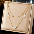 Detail of double-layer gold plated necklace with white heart charms and shell inlays - White Shell Heart Necklace (N4076)