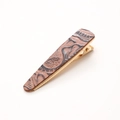 Detail of vintage leopard print leather hair clip with gold metal clasp on white background - Brown Embossed