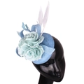 Blue linen fascinator hat with flower and white feathers on a display mannequin - Light Blue