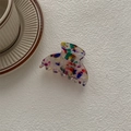 Detail of colorful speckled acetate hair claw clip on textured white surface - Ghost Hand Claw / Multicolor