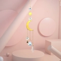 Detail of crystal suncatcher with golden crescent moon, stars and prismatic glass spheres - US 6