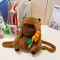 Cute brown capybara plush backpack holding an orange flower on a desk background - Holding Orange Flower (Plush Strap)