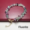 Close-up of a colorful fluorite crystal chip bracelet with adjustable gold clasp - Fluorite