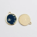 Detail of round star moon enamel pendants showing blue finish and gold texture back - Blue Star