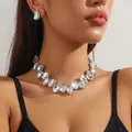 Close-up of a glamorous crystal choker necklace and matching oval stud earrings set - Oval White Crystal + Earrings