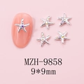 Detail view of 9x9mm silver starfish nail charms with iridescent rhinestones on pink nails - MZH-9858 (9*9mm)