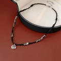 Bamboo style beaded necklace with silver hollow pendant and dark grey stone accents - Necklace-Black