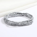 Macro shot of layered silver metal beads jewelry on beige fabric background - 80cm / Silver Metal Beads