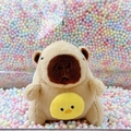 Cute capybara plush keychain with a yellow chick accessory and metal ball chain - Holding Chick Light Brown + Bead Chain
